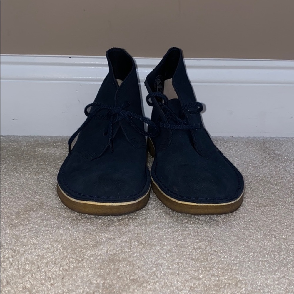 Navy Clark desert boots.